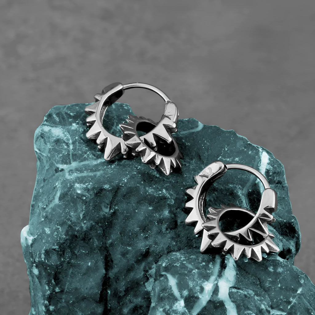 Stainless steel round ring earrings with polished steel finish and retro design influences