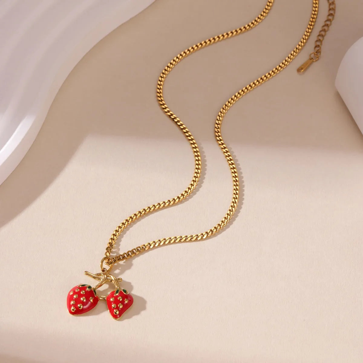 Stainless steel strawberry fruit pendant necklace for women in white gradient or red colour on alloy chain