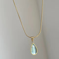 Retro blue and green water drop necklace with titanium steel chain and mixed gemstone pendant