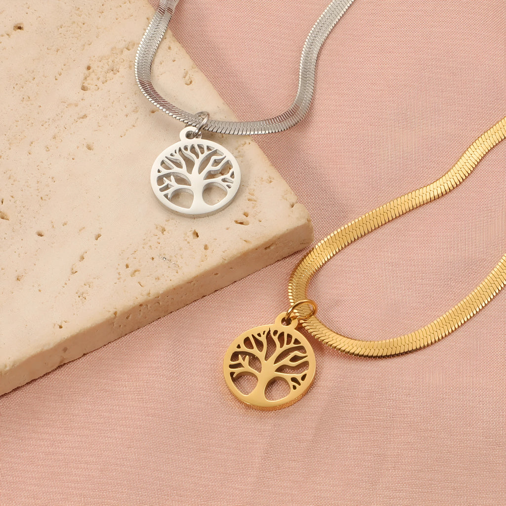 Stainless steel tree pendant necklace on a textured snake bone chain, shown in gold colour.