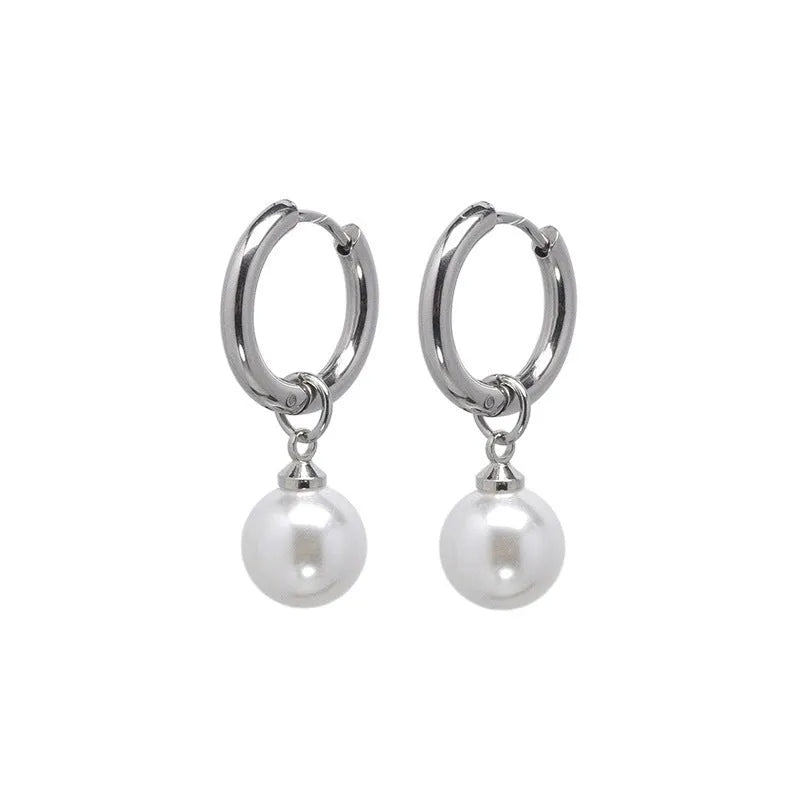 Geometric women's pearl earrings with titanium steel posts on a white background.