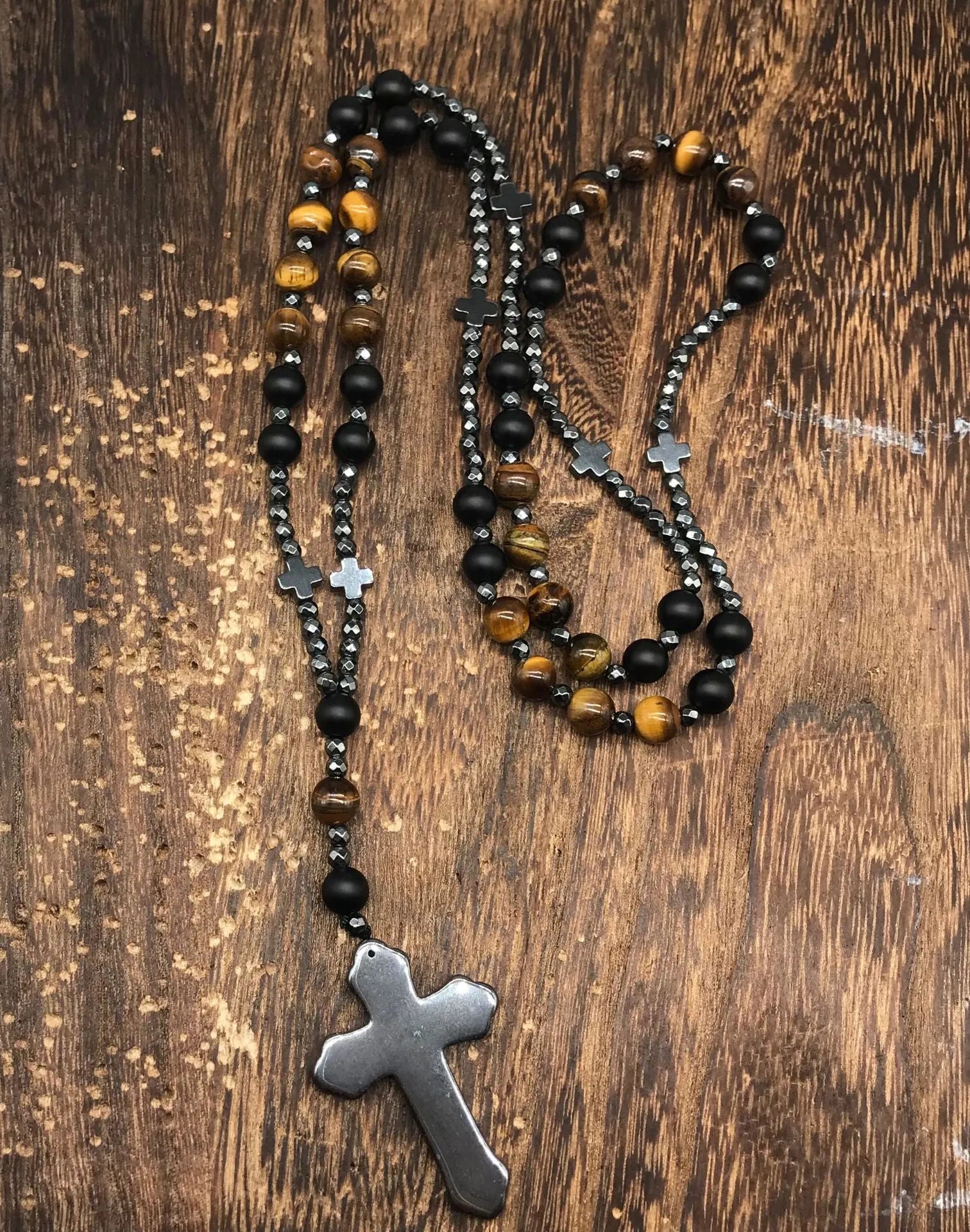 Men's stone cross pendant necklace on a ball bead chain with a safety lock clasp.