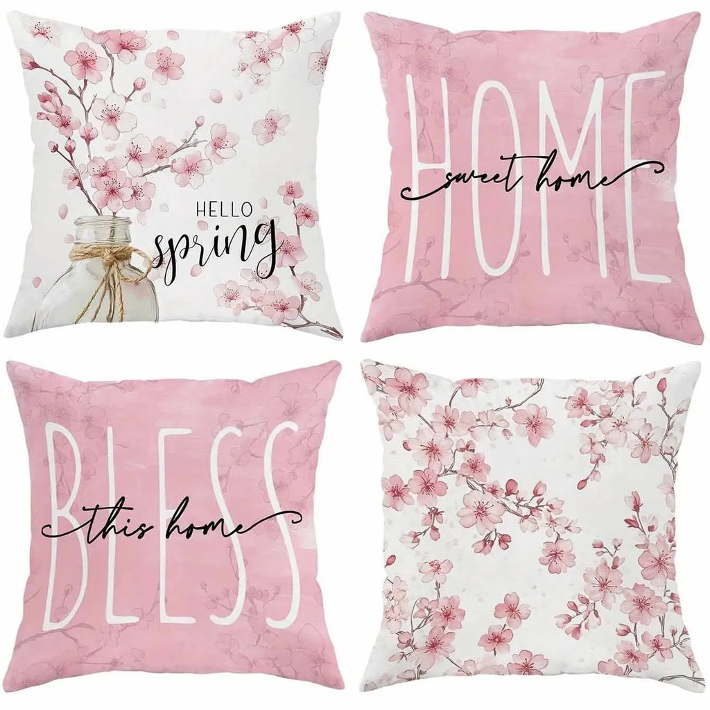 Short velvet square cushion cover with cherry blossom letter print, shown in one of four colour options.