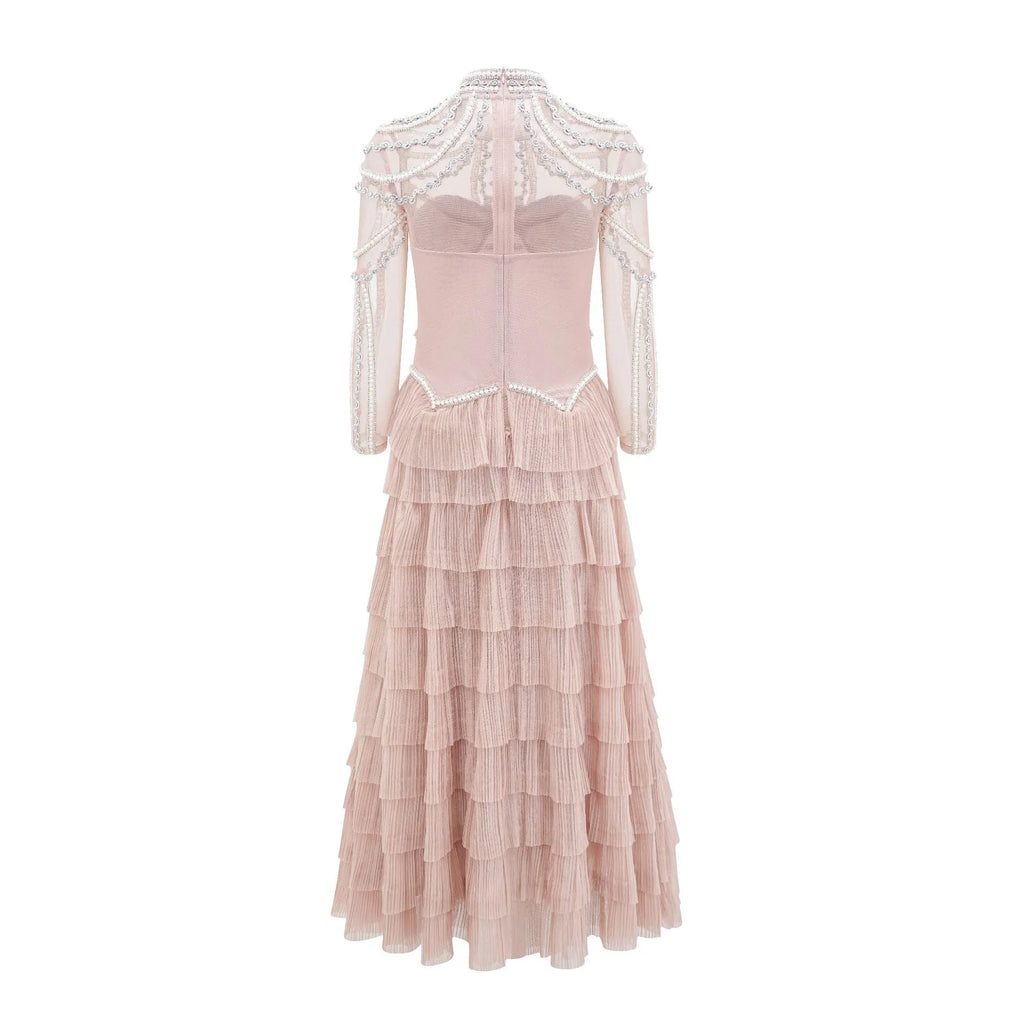 Black and pink women's long sleeve dress with beaded decoration on the front.