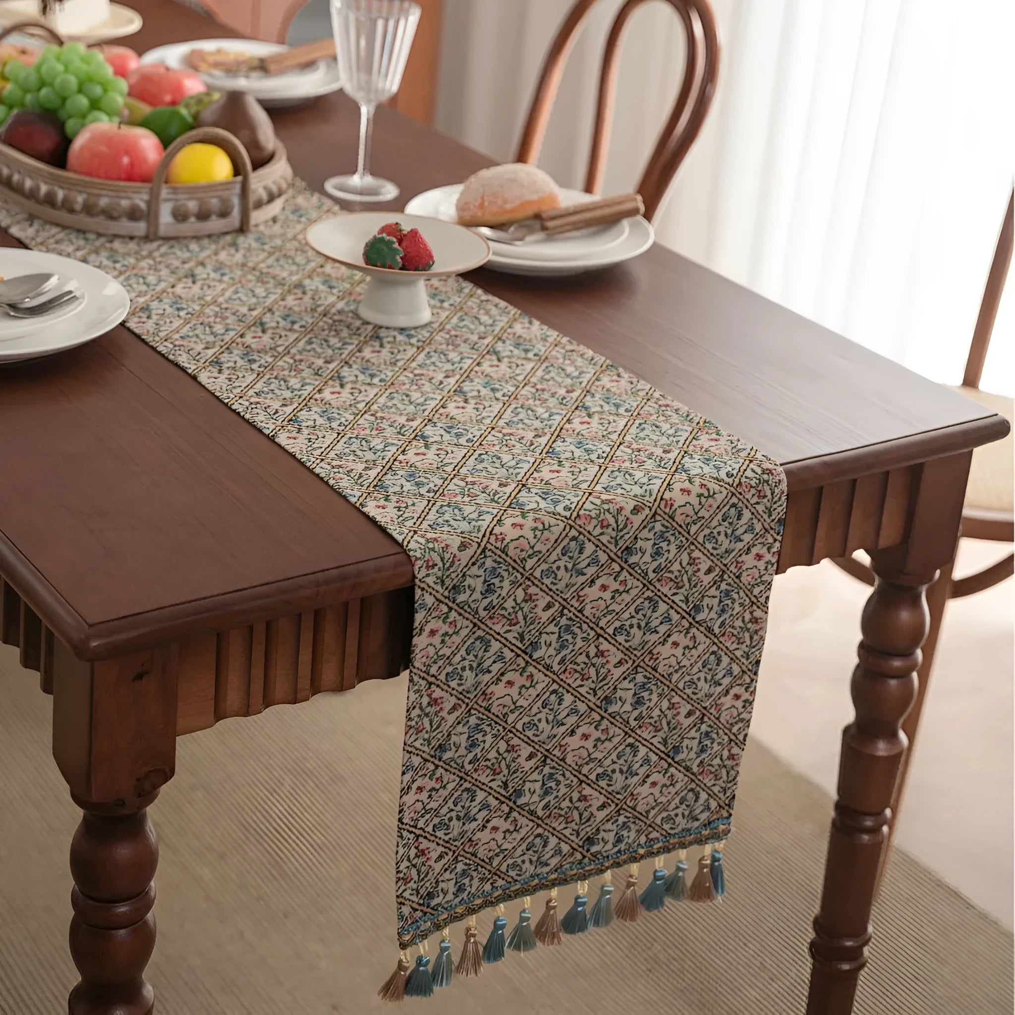 Dark blue striped Nordic jacquard bouquet table runner with tassel trim laid flat on a table.