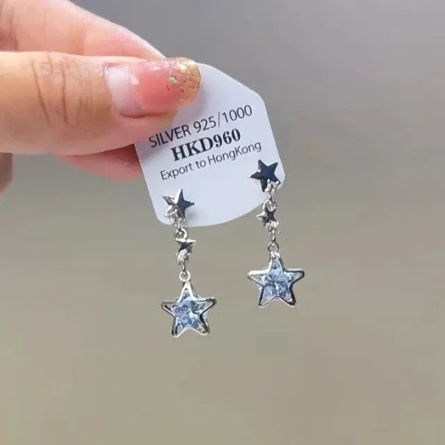 Geometric heart-shaped alloy ear clips with rhinestone and star tassel decorations in gold tone finish