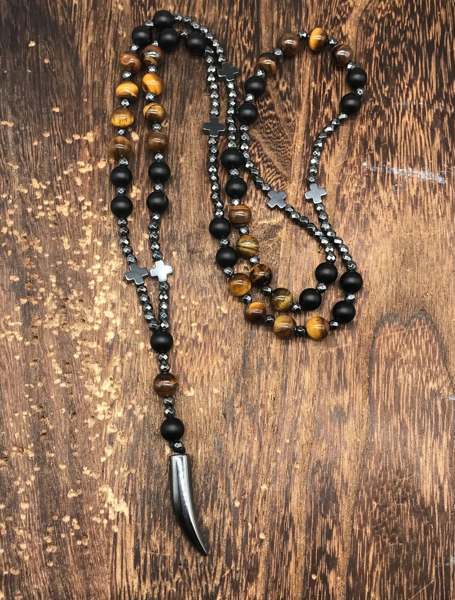Men's stone cross pendant necklace on a ball bead chain with a safety lock clasp.