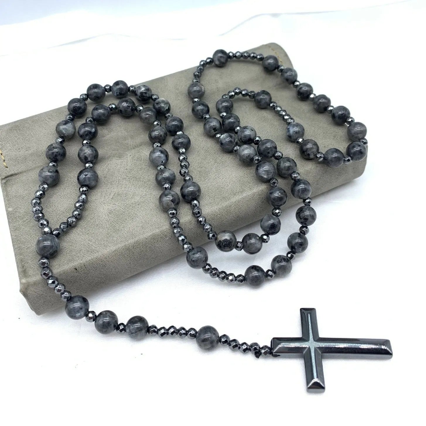 Men's stone cross pendant necklace on a ball bead chain with a safety lock clasp.