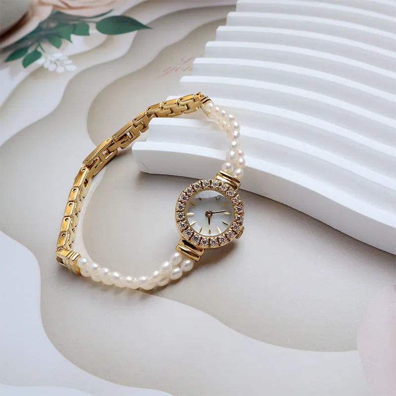 Women's light gold bracelet watch with freshwater pearl dial and stainless steel strap