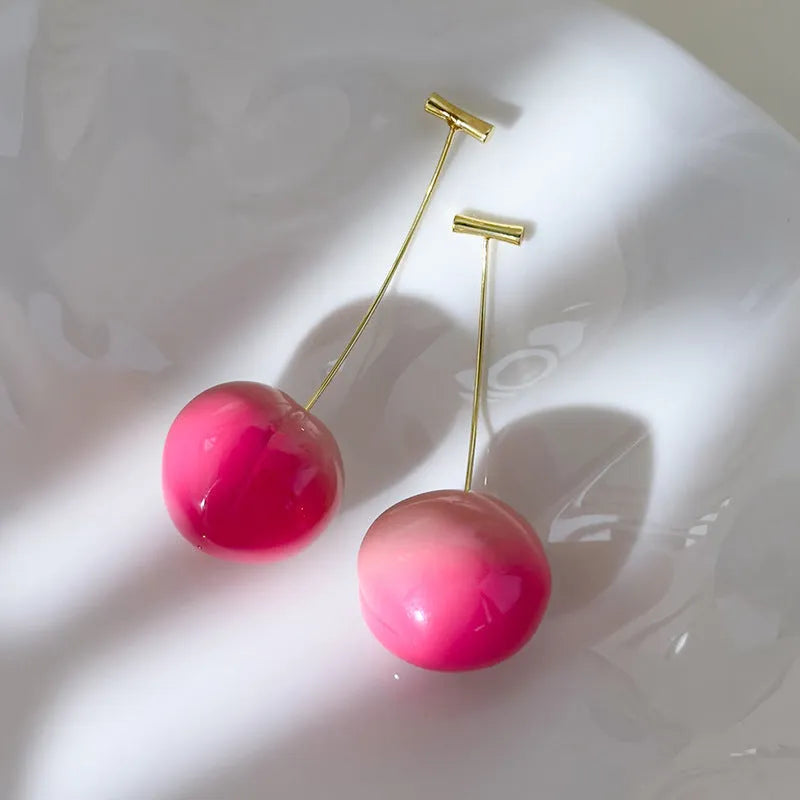 Acrylic peach fruit earrings showing small and large size options with copper findings