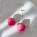 Acrylic peach fruit earrings showing small and large size options with copper findings
