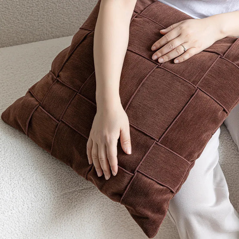 Chenille woven square pillow cushion in beige colour on a sofa