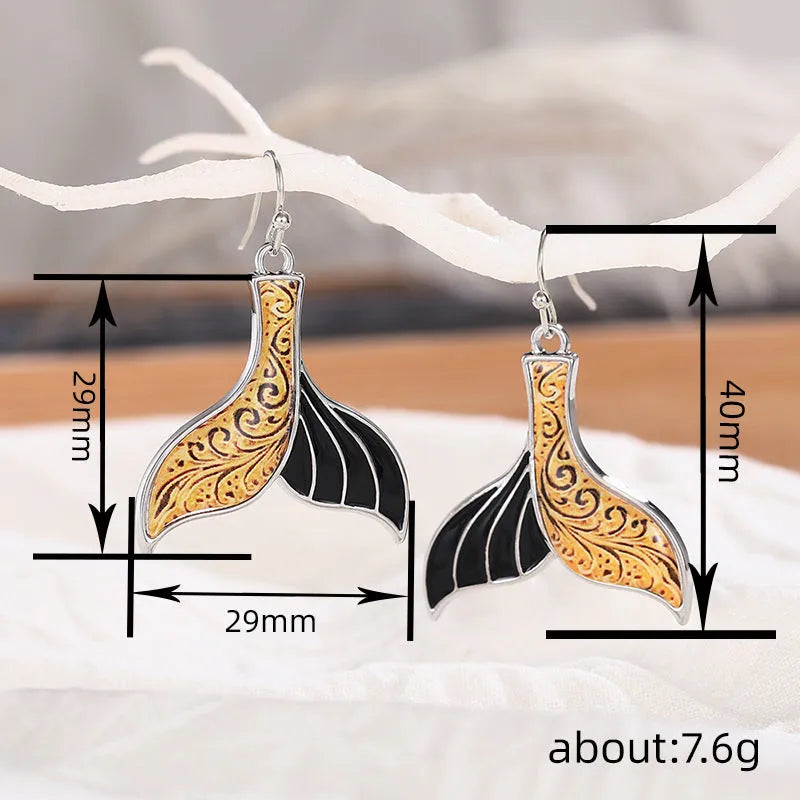 Women's fishtail earrings with retro whale design in white gold colour alloy metal