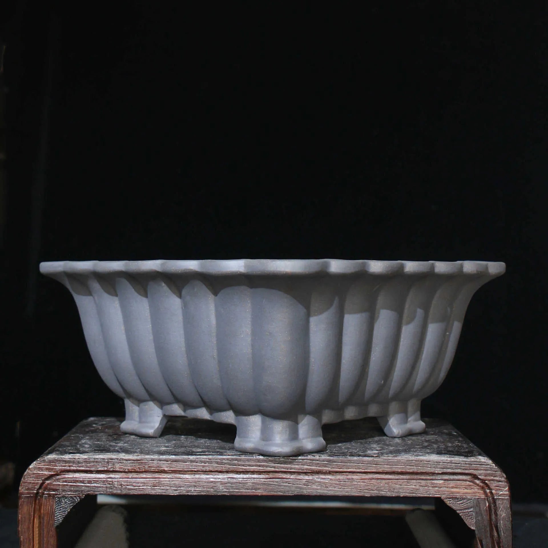Square purple sand ceramic bonsai pot with classical styling on desktop