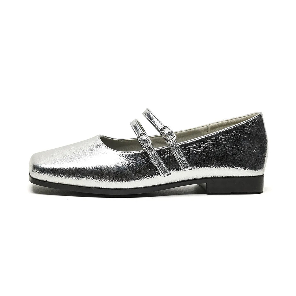 Women's silver ballet slipper pumps with a cross buckle strap, made from sheepskin leather with a flat heel.