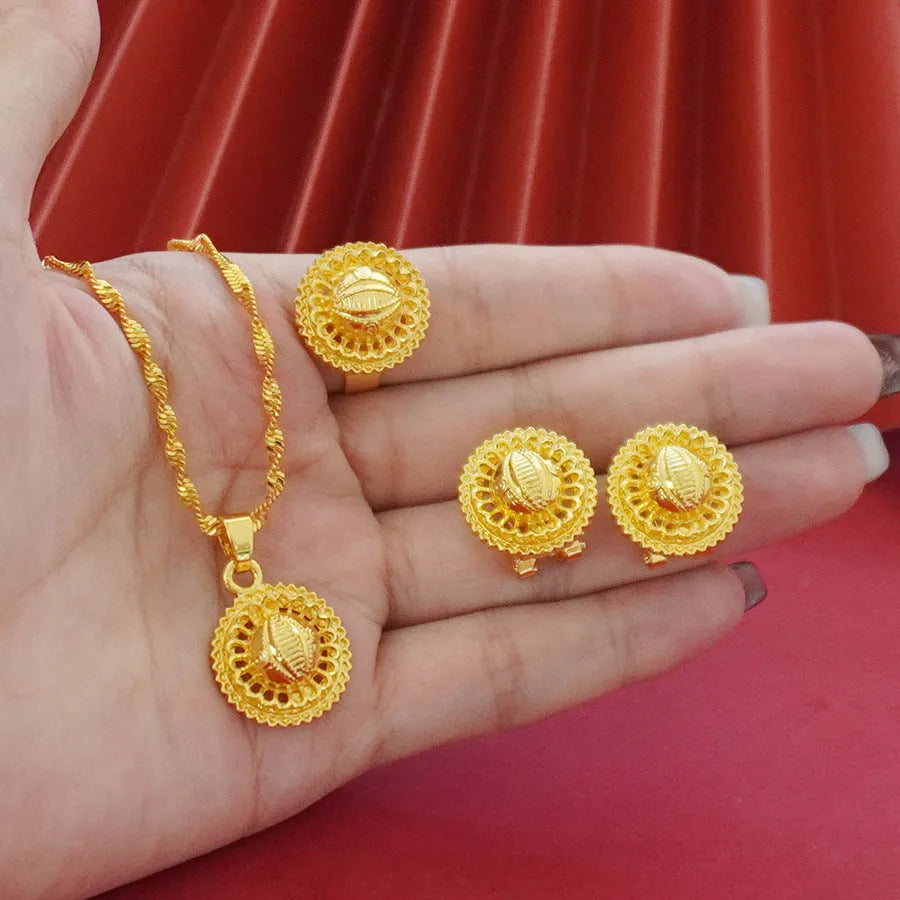Three-piece gold electroplated jewellery set showing necklace with pendant, earrings, and matching ring