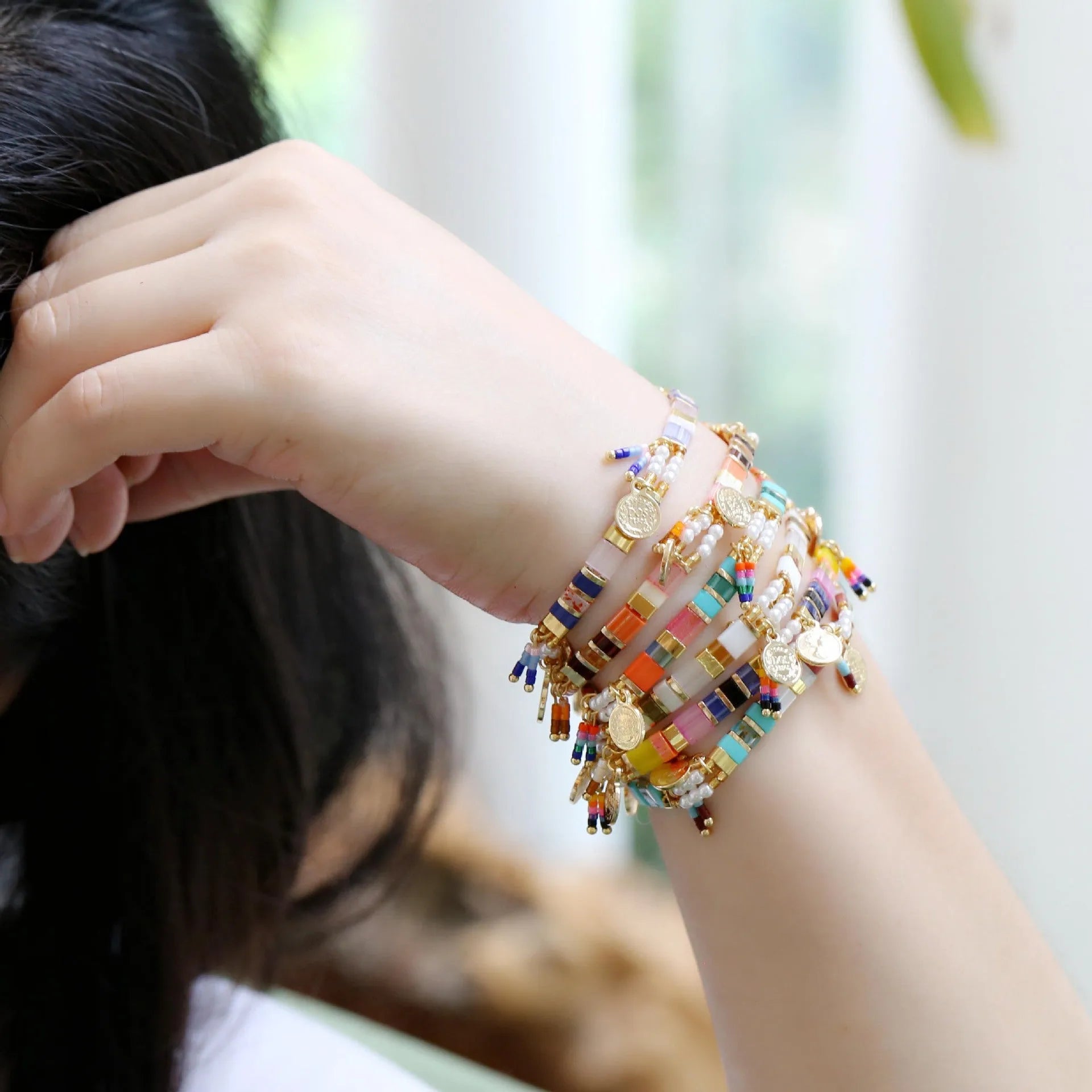 Women's imitation pearl beaded bracelet with glass coloured beads in six pearl lifting colour options