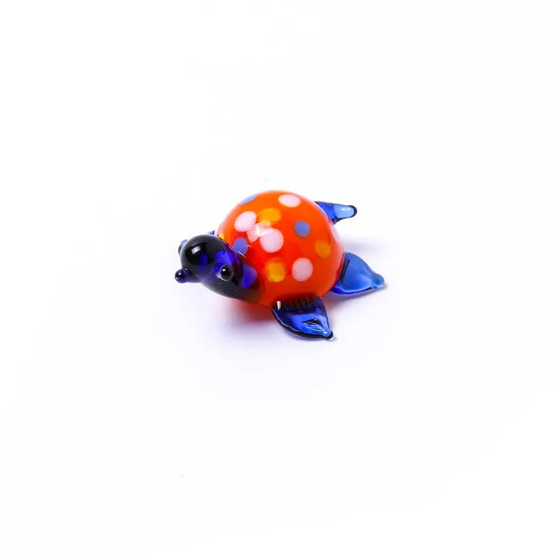 Geometric glass turtle desktop ornament in a modern style with colourful shell and head.