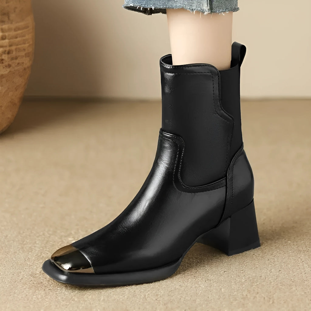 Brown women's cowhide Martin ankle boots with a high heel and side zipper on a white background.
