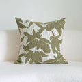 Green cotton and linen hotel sample pillow with botanical pattern and tassel trim