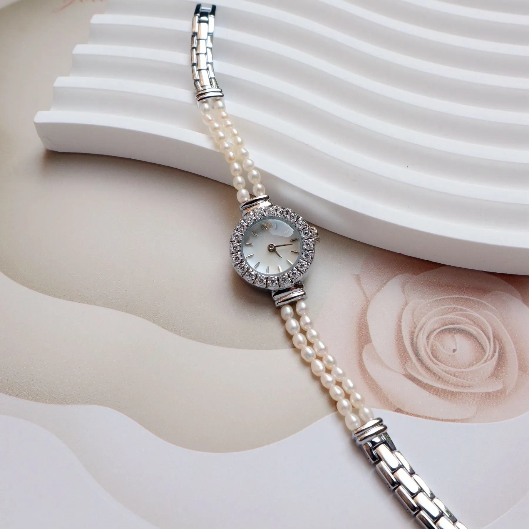 Women's light gold bracelet watch with freshwater pearl dial and stainless steel strap