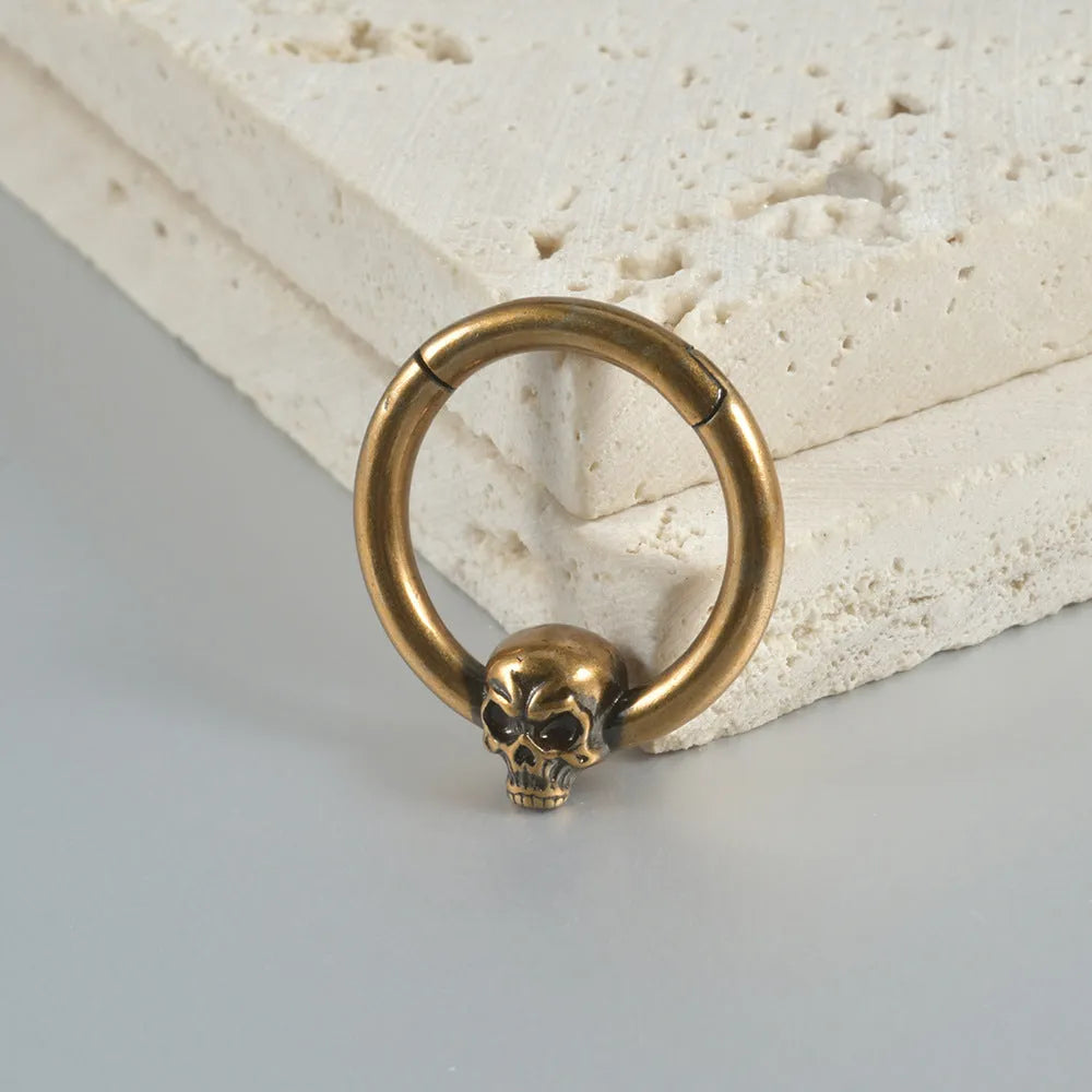 Vintage copper punk earrings with ghost head motifs in antique silver or gold finish