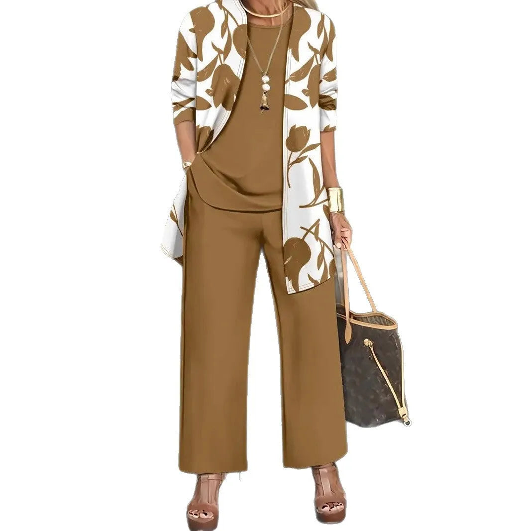 Women's blue three-piece casual suit featuring a long-sleeve coat, a vest, and full-length trousers.