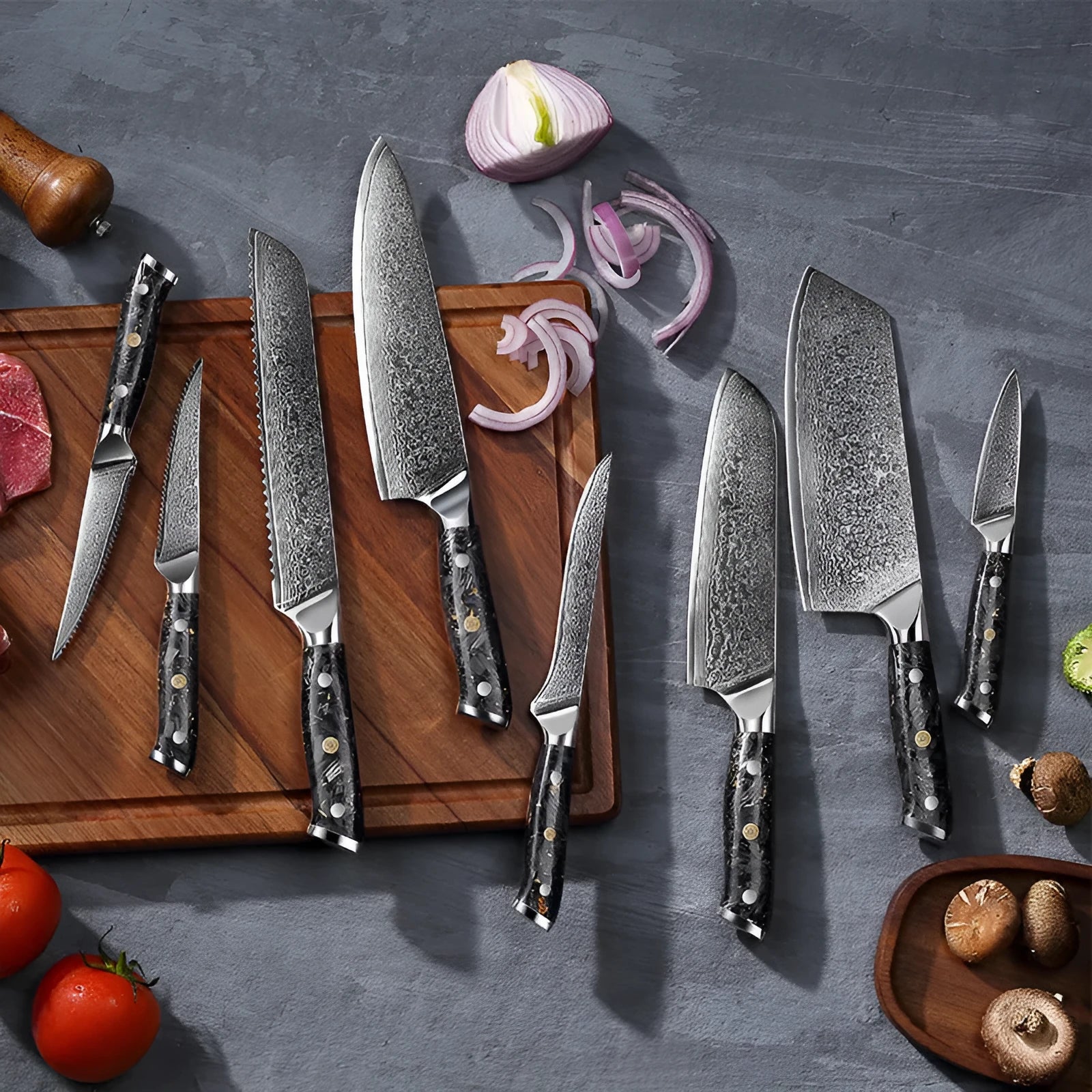 67-layer Damascus steel kitchen knife set with fishbone pattern showing eight different blade sizes and types