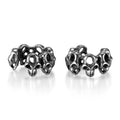 Stainless steel skull earrings with clip-on fastening and hollow geometric design