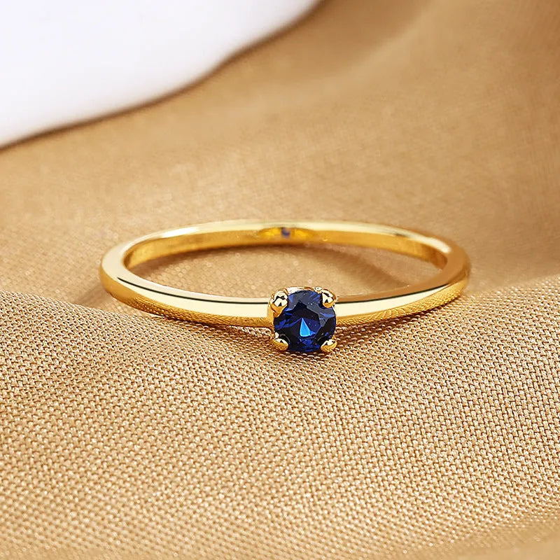 Copper geometric ring with single diamond available in white red green blue sizes 6-9
