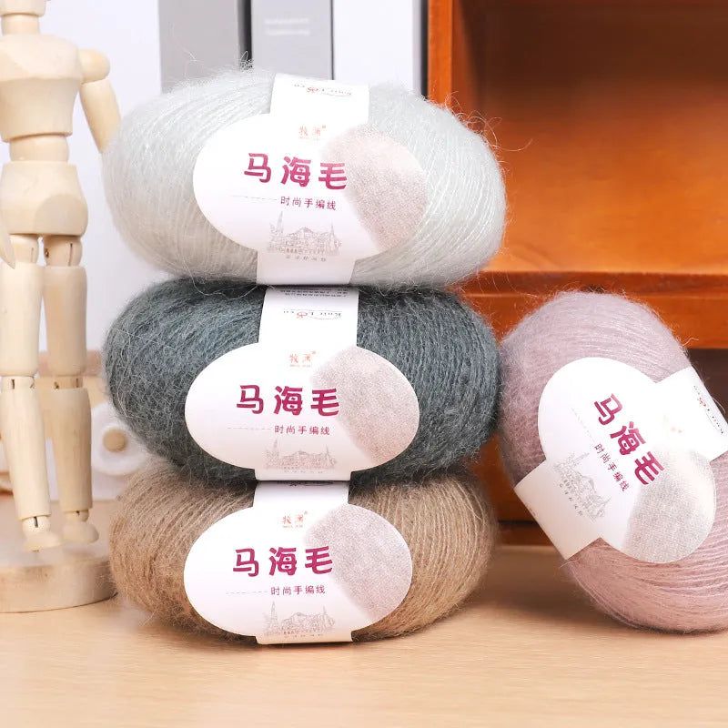 Single ball of mohair yarn in various colours for hand-woven DIY scarf knitting projects
