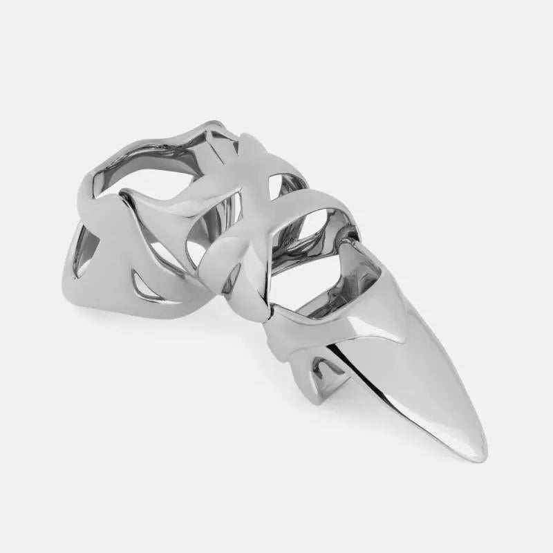 Silver colour alloy metal punk armour finger stall ring on a finger.