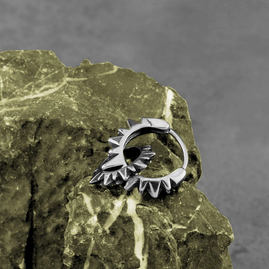 Stainless steel round ring earrings with polished steel finish and retro design influences