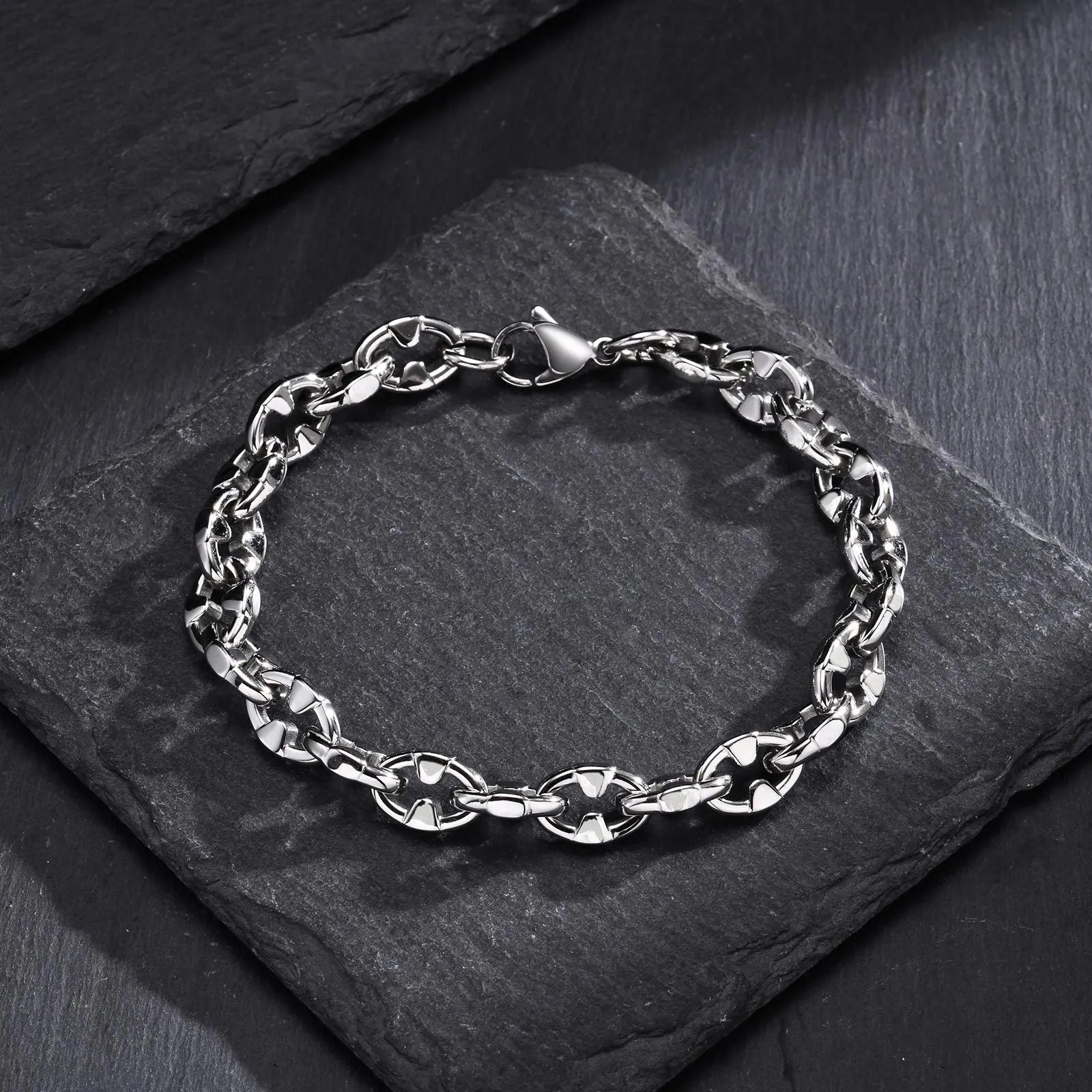 A thick geometric chain bracelet made of stainless steel, shown in a steel colour finish.