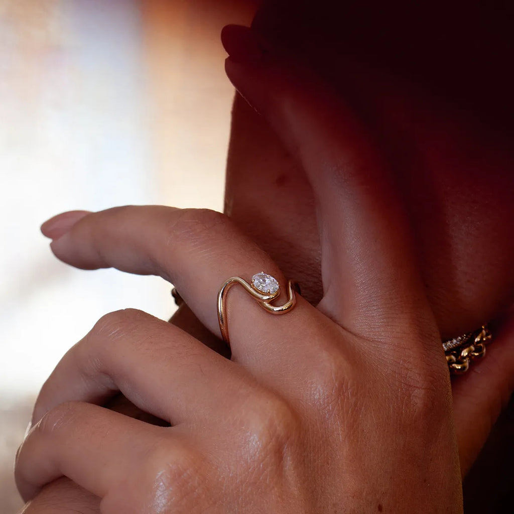 Geometric zircon ring in titanium steel with non-fading finish on a hand.