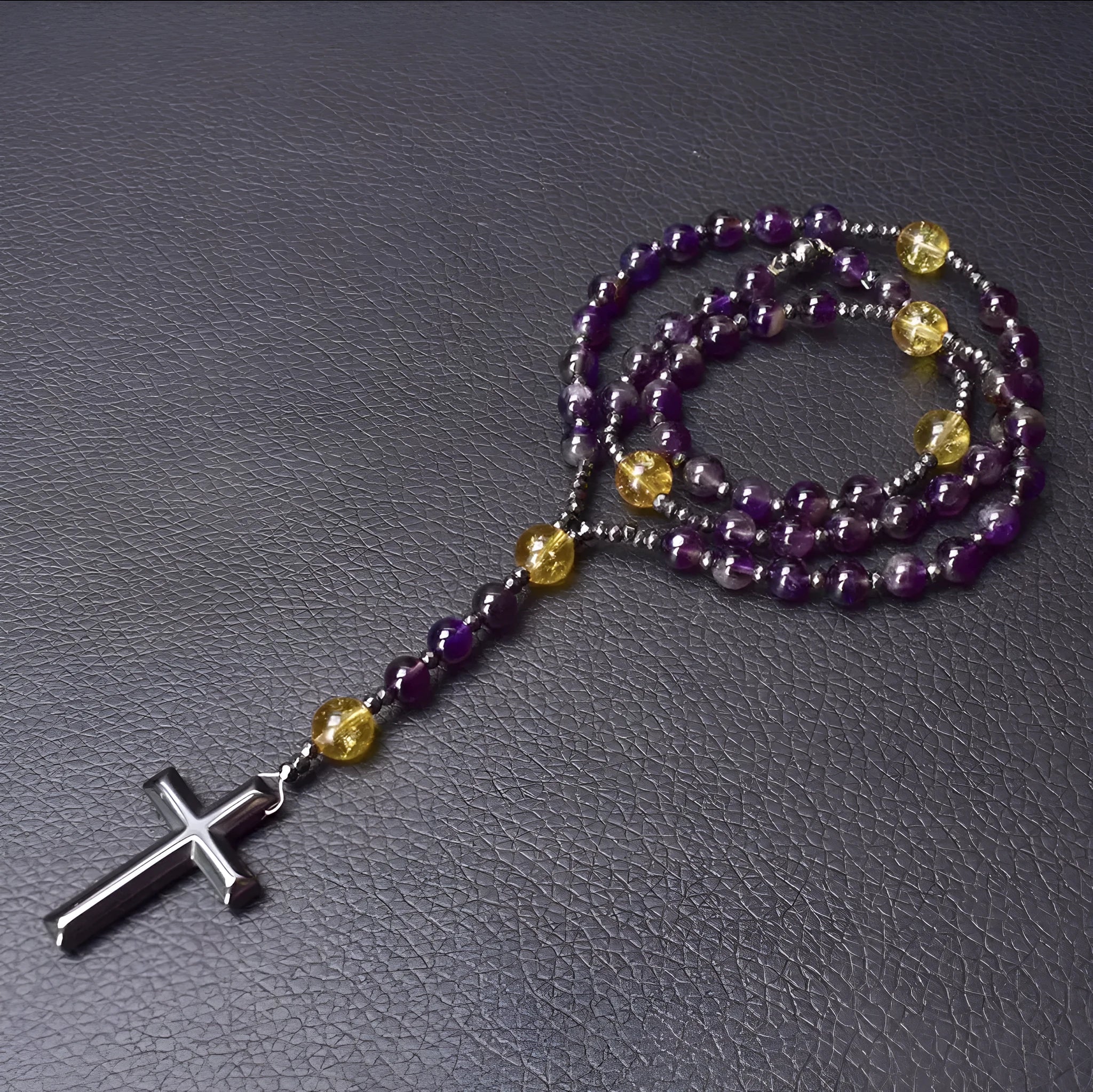 Men's stone cross pendant necklace on a ball bead chain with a safety lock clasp.
