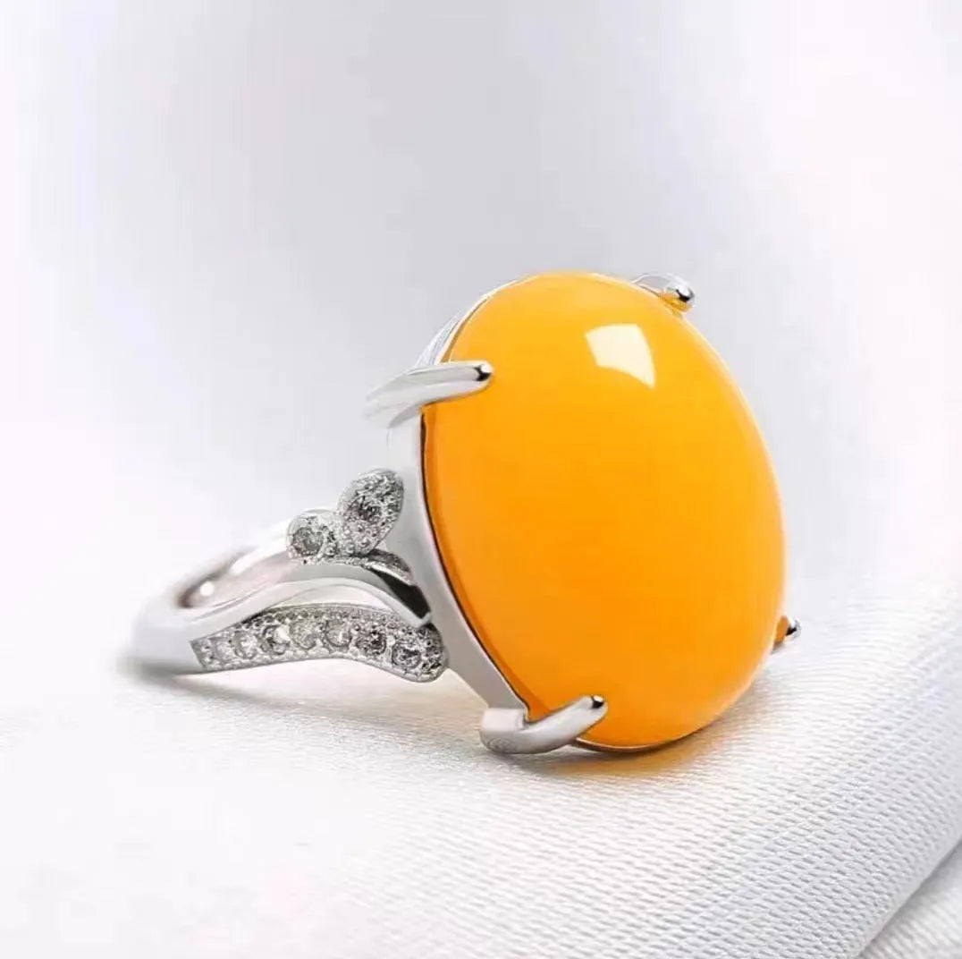 Geometric-style adjustable alloy ring in five colour options on a neutral background.