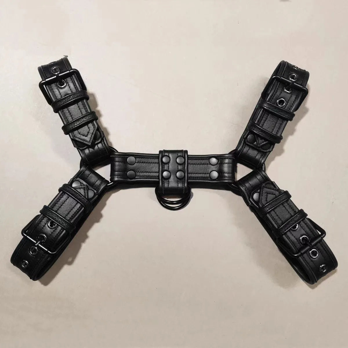 Black leather adjustable chest strap with metal buckle for men's costume and party wear