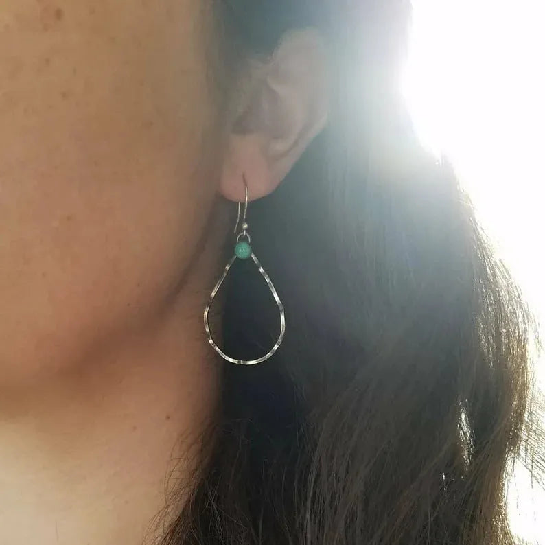 Circular geometric earrings with turquoise centre and antique silver finish