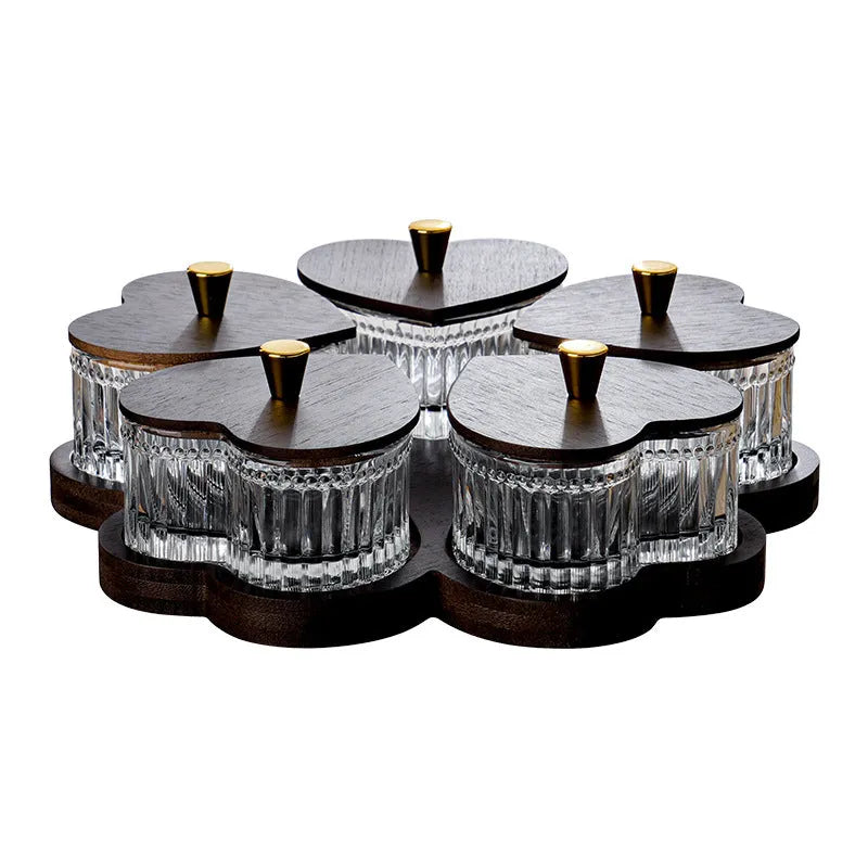 Transparent heart-shaped glass snack plate with multiple compartments and lids for organised food serving