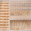 108 geometric pearl earrings with round elements in gold and yellow electroplated alloy