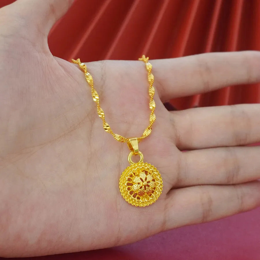Three-piece gold electroplated jewellery set showing necklace with pendant, earrings, and matching ring