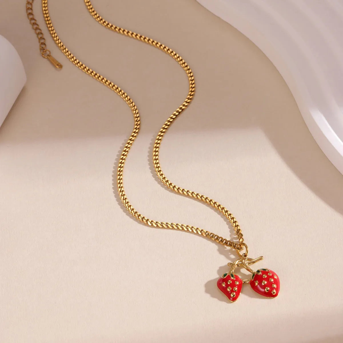 Stainless steel strawberry fruit pendant necklace for women in white gradient or red colour on alloy chain