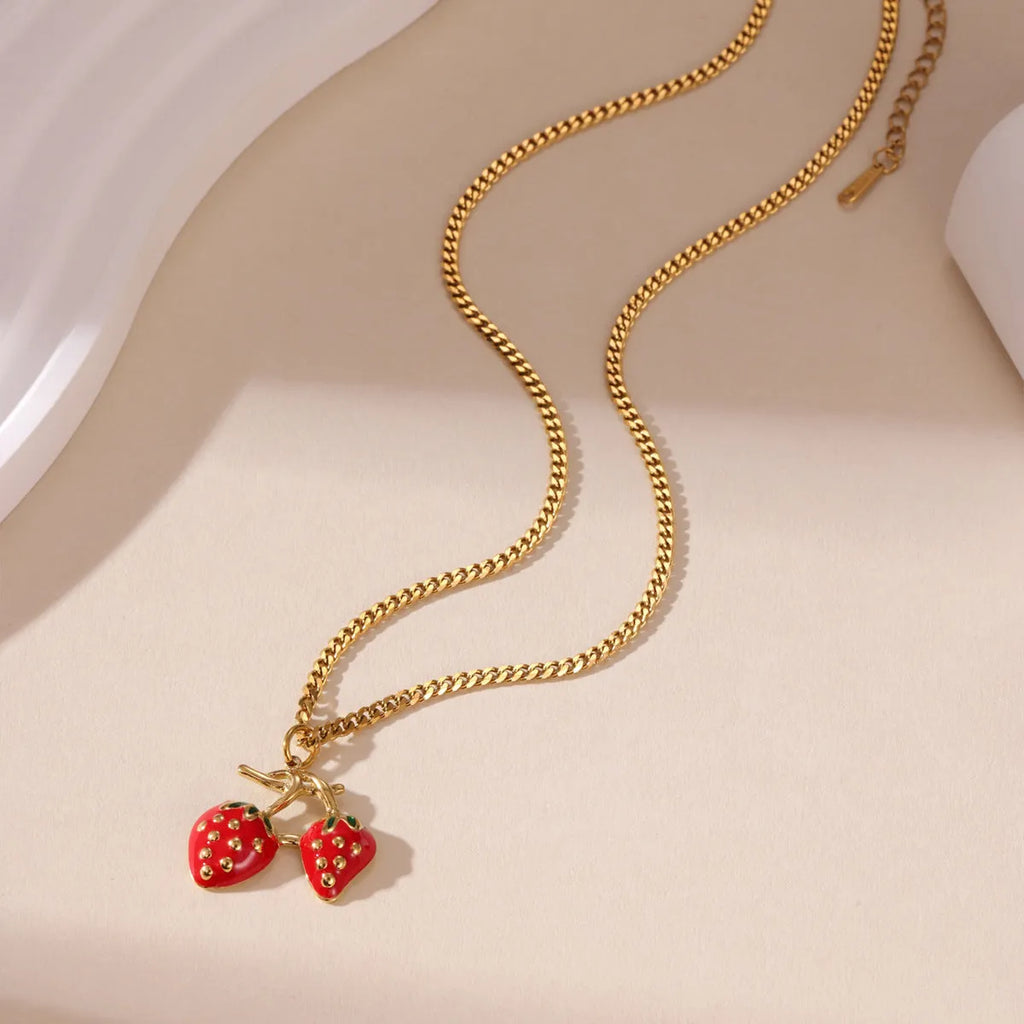 Stainless steel strawberry fruit pendant necklace for women in white gradient or red colour on alloy chain
