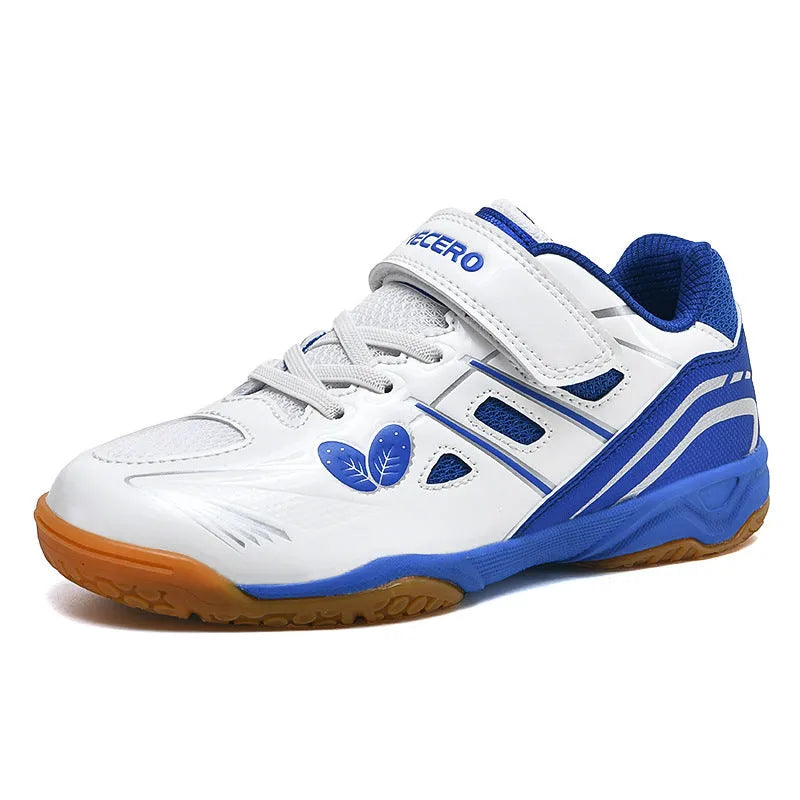White and blue breathable PVC badminton shoes with a ribbed sole on a court surface.