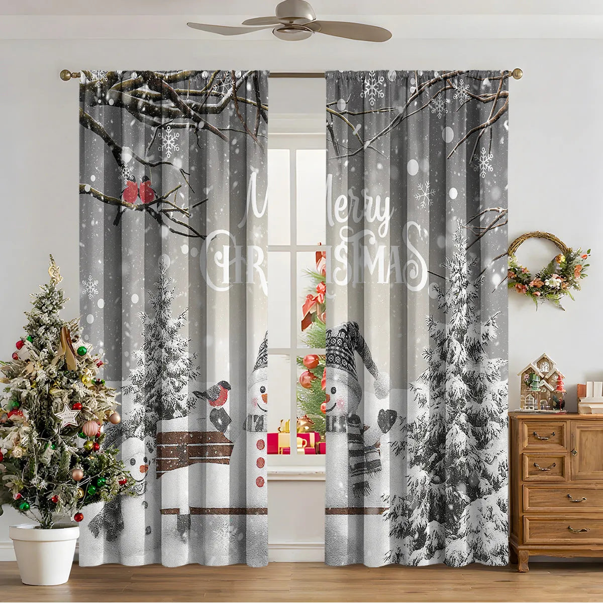 Set of two red and green 3D digitally printed Christmas theme curtains hanging on a window.