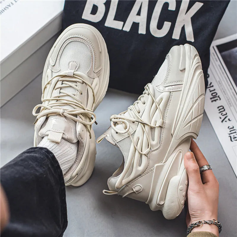 Men's low-top sneaker in beige with breathable mesh upper and rubber sole, lace-up design.