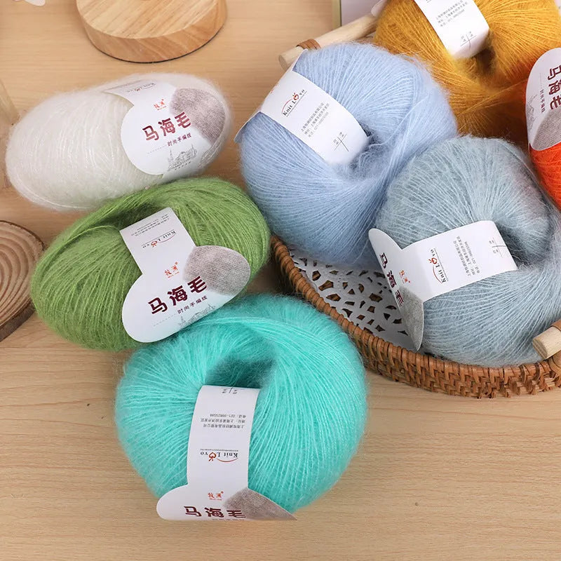 Single ball of mohair yarn in various colours for hand-woven DIY scarf knitting projects