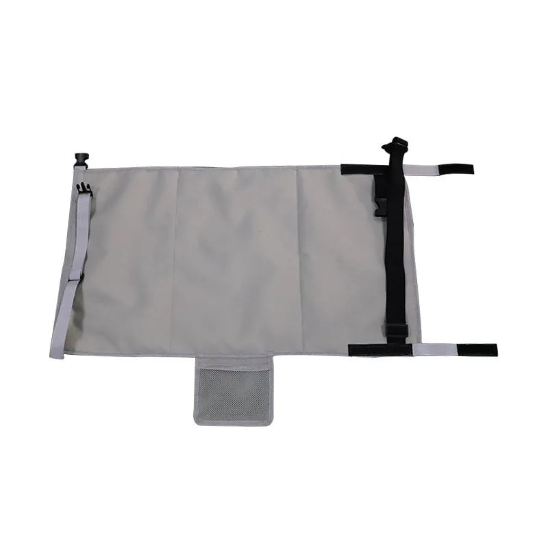 Portable grey nylon children's aircraft seat pedal extender with a matching drawstring pocket.