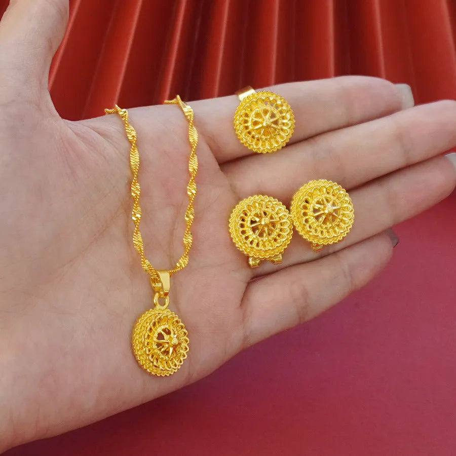 Three-piece gold electroplated jewellery set showing necklace with pendant, earrings, and matching ring